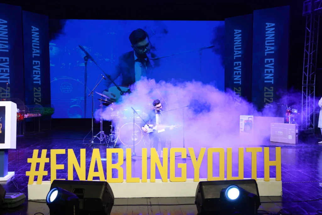 BI executive singing at touchstone annual event